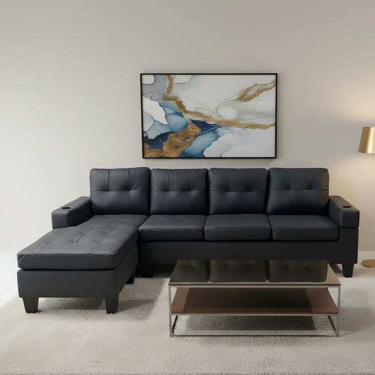 Modern living room with a gray sectional sofa, coffee table, and abstract art on the wall.