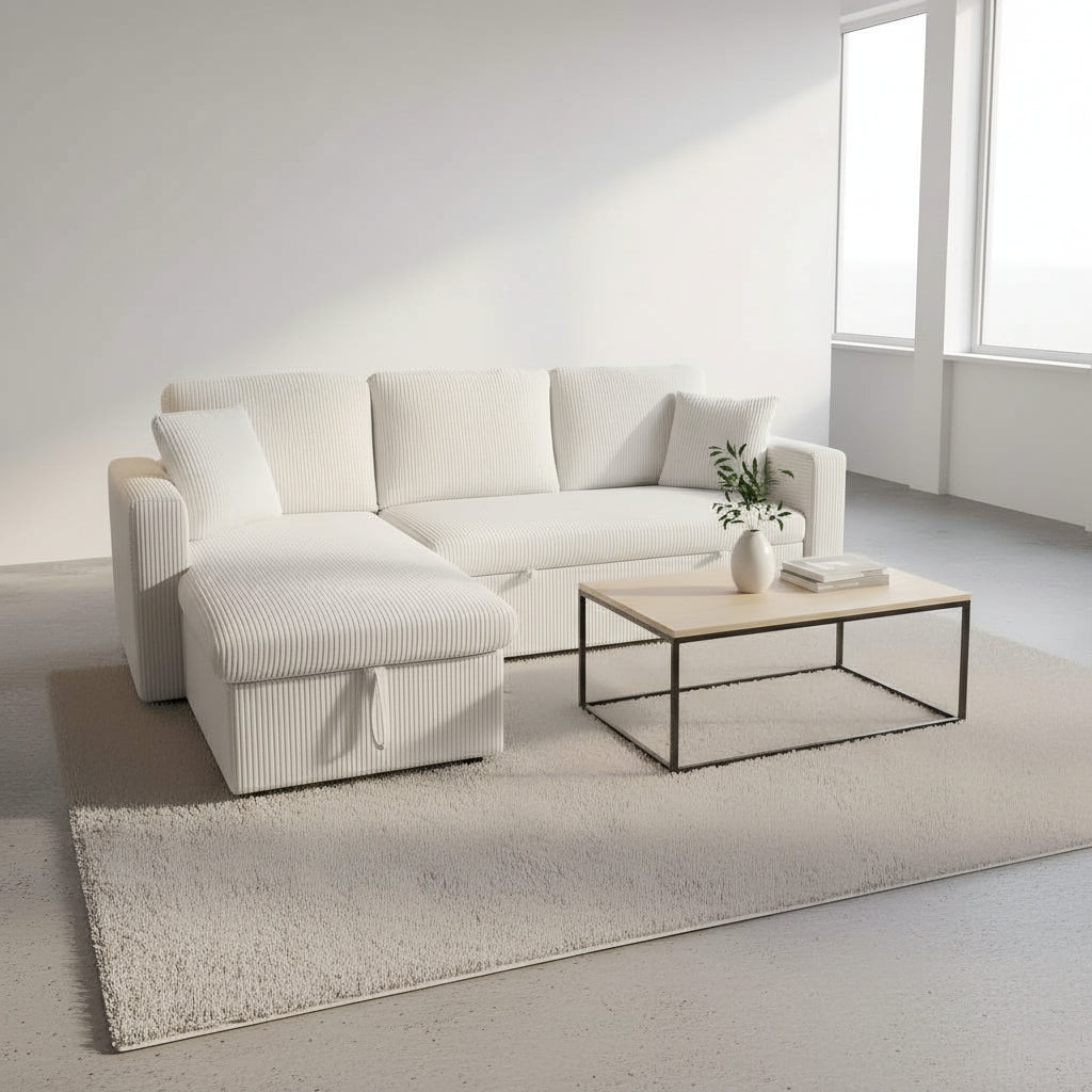 White sectional sofa in a modern living room with abstract art and a lamp.