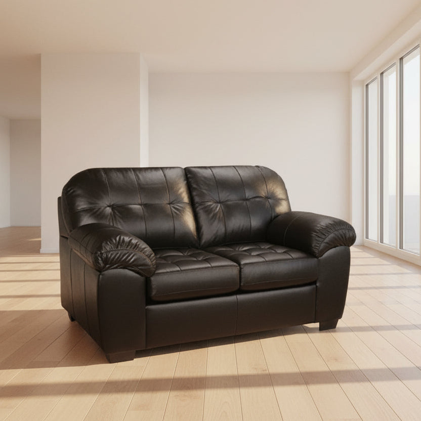 Black leather sofa on a white background