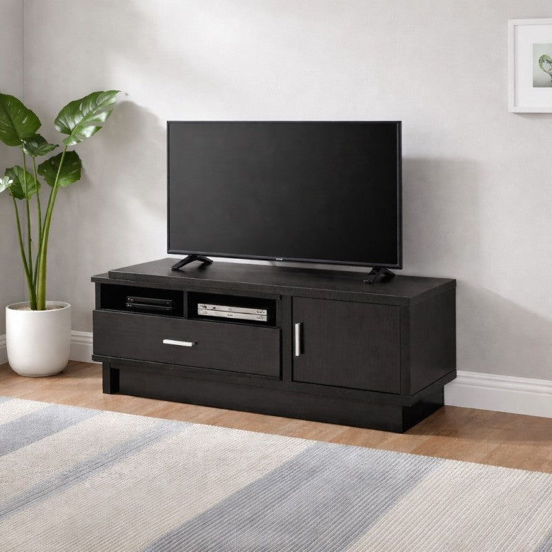 Black TV stand with a television in a living room setting.