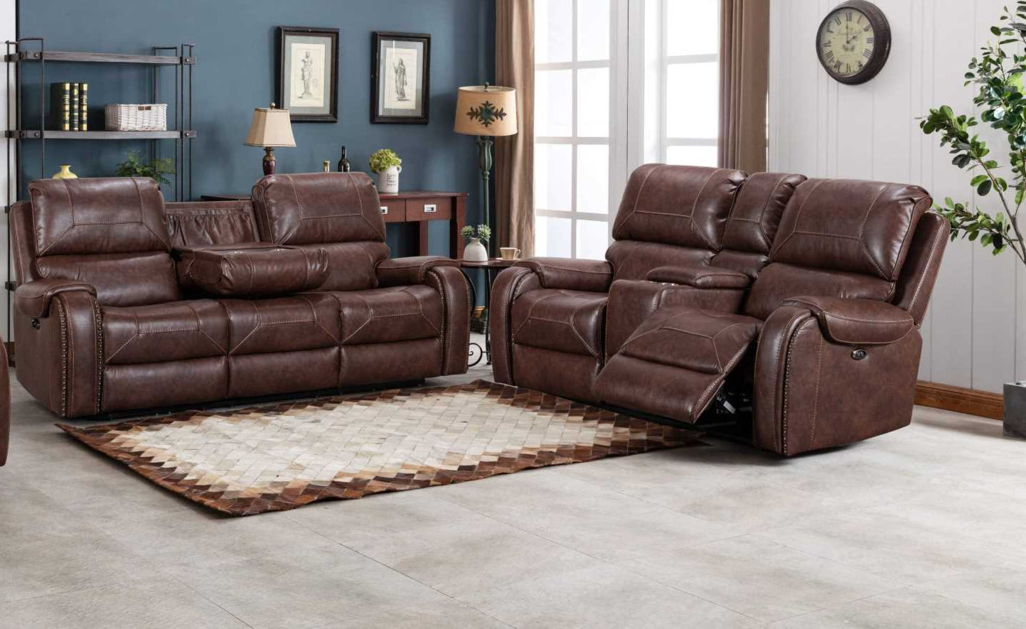 A two-piece brown genuine leather power recliner sofa set, with a loveseat and a sofa, featuring drop down trays with cup holders and USB charging ports, placed in a room with a white carpet, blue walls, and a wooden floor.