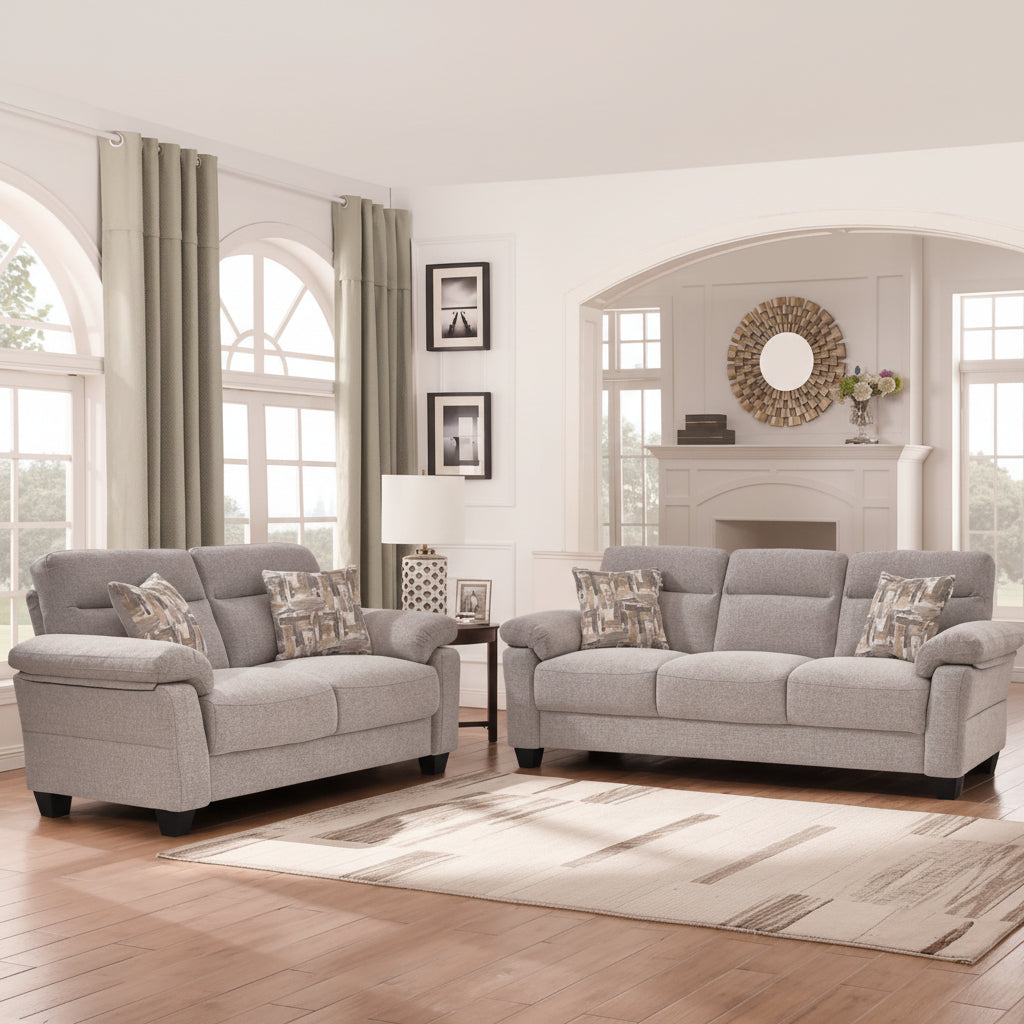 Gray sofa set in a living room with decorative elements.