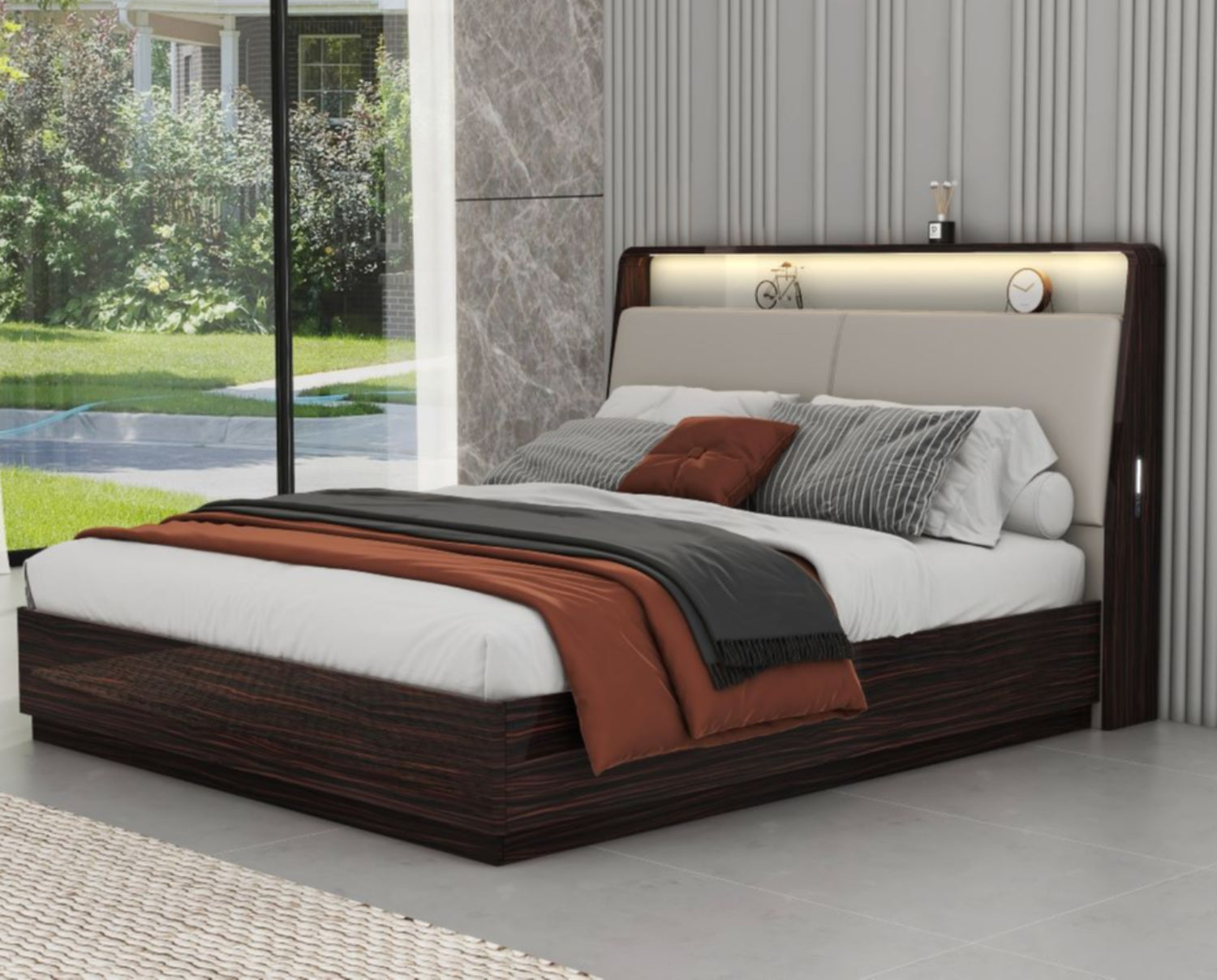 Modern bedroom setup with a bed, pillows, and a view of a garden.