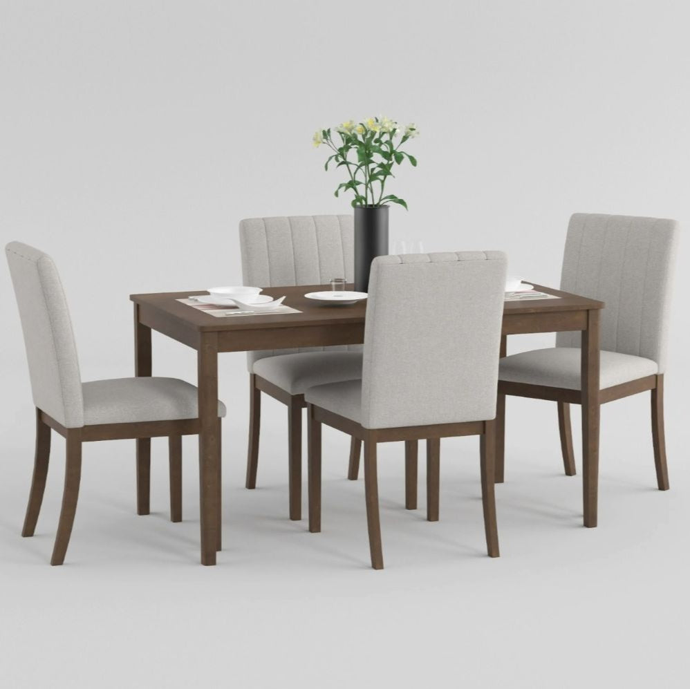 Dining table set with four chairs on a white background