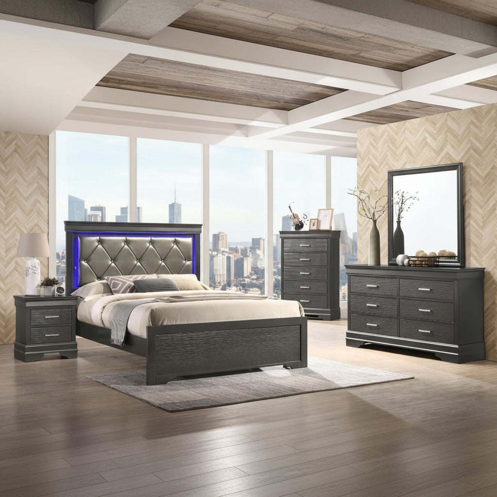 A bedroom set featuring a queen-sized bed with a gray headboard and wood finish, a dresser with a mirror, and a nightstand, all set in a room with a chevron pattern on the walls and a rug on the floor.