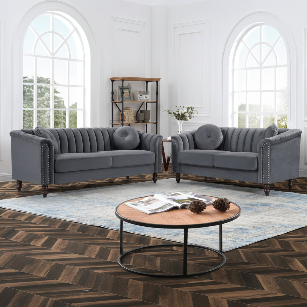 Gray sofa set in a living room with a coffee table and decorative items.