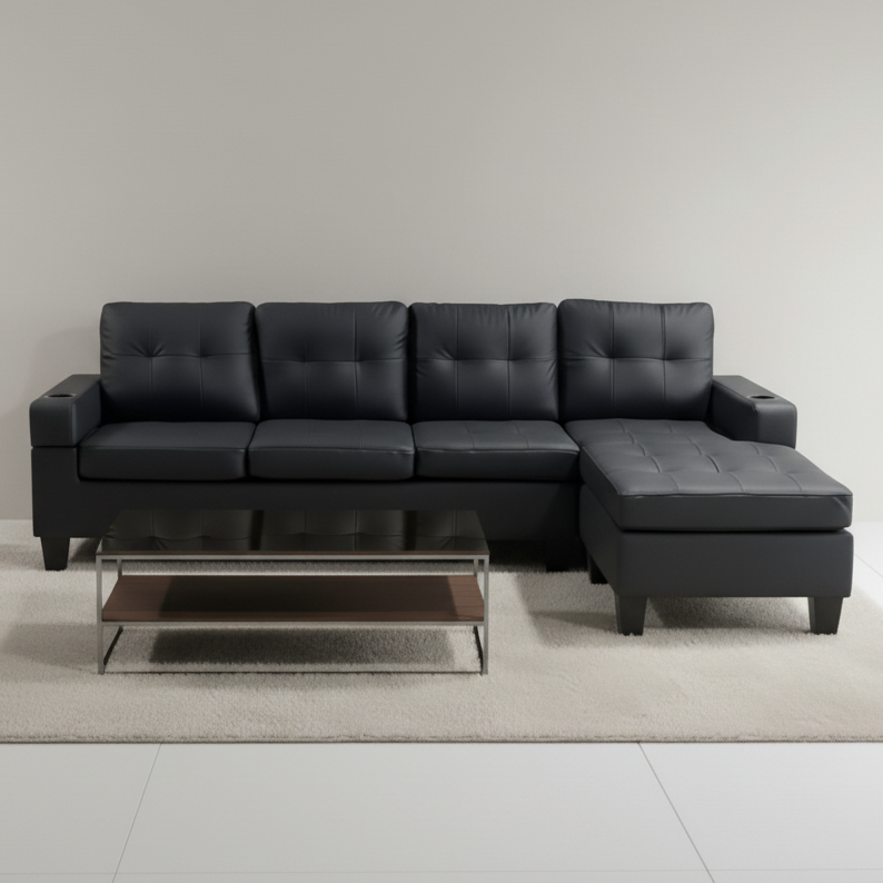 Black leather sectional sofa with a coffee table on a light gray floor and background