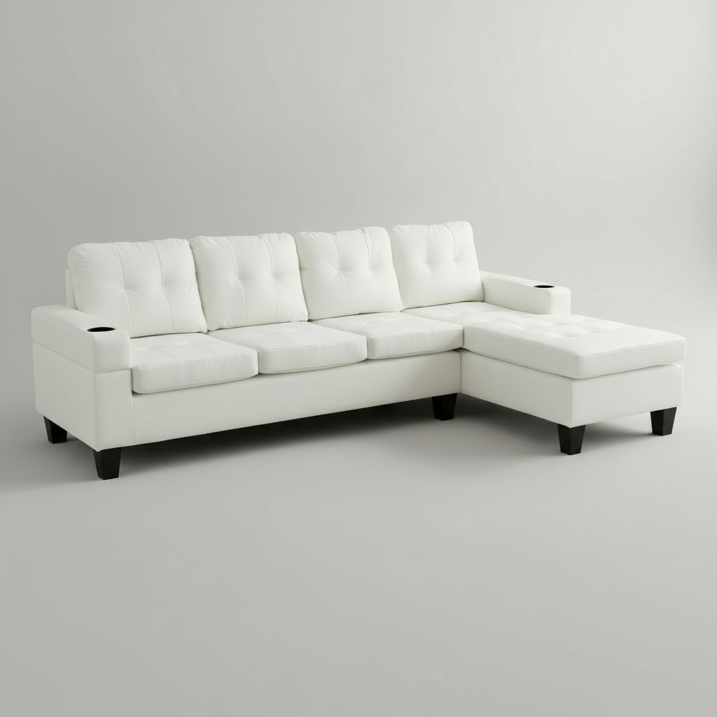 White sectional sofa in a living room with a coffee table and decor items.