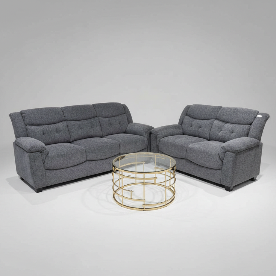 Gray sectional sofa with a gold coffee table on a gray background