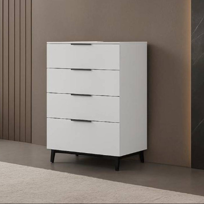 White dresser against a modern interior wall with large windows.