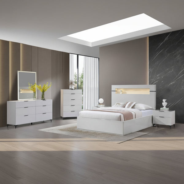 Modern bedroom set with white furniture including a bed, dressers, and nightstands.