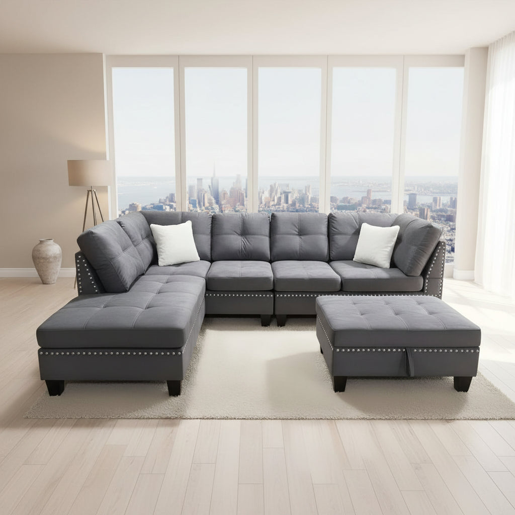 Gray sectional sofa with ottoman in a living room setting, labeled '1013 snow grey'.
