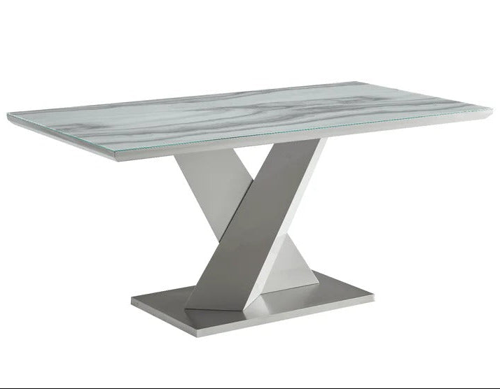 Modern glass dining table with a metallic base on a white background