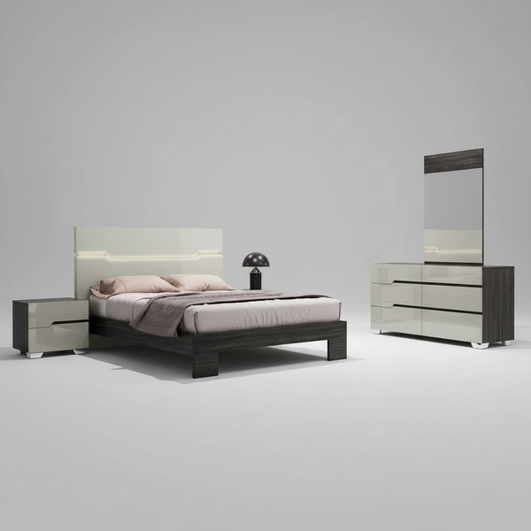 A gray lacquer finished 2-drawer nightstand with a mirrored image of a skyscraper-filled cityscape in the background, placed in a bedroom setting.