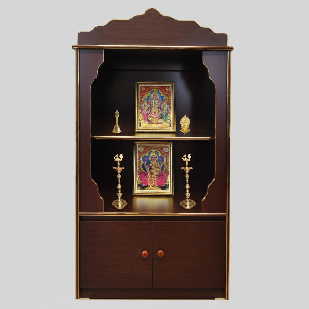 A wooden pooja cabinet with cherry color and gold molding, featuring doors, shelves, and decorative elements, set against a patterned backdrop with Om symbols on the sides.